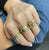 Marquise bezel diamond ring with rainbow eternity band
