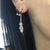 Moonstone and Diamond Hoop Earrings on model