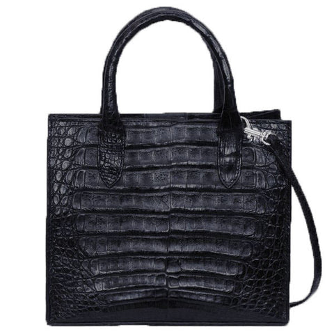 Stunning Exotic Genuine Crocodile Cross Body Handbag from the exclusive Coly collection features a removable longer strap, protective Silvertone feet, soft leather interior, magnetic closure, and two inside pockets. Dimensions are 9"W x 7.5"H x 4"D. Handmade in Los Angeles.