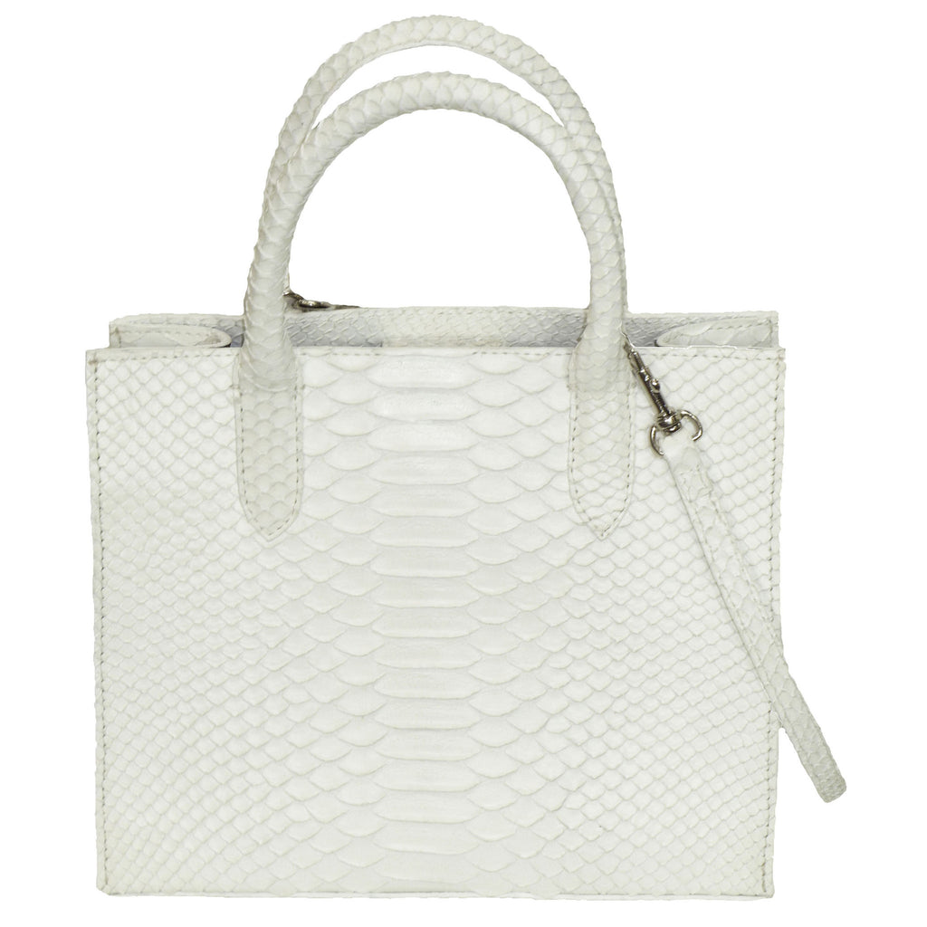 Stunning White Cross Body Handbag from the exclusive Coly collection features a removable longer strap, protective Silvertone feet, soft leather interior, magnetic closure, and two inside pockets. Dimensions are 9"W x 7.5"H x 4"D. Handmade in Los Angeles.