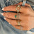 Twirl diamond ring with emerald ring