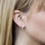Rounded Pave Diamond Huggie Earrings on model